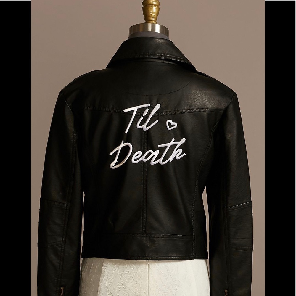 Embroidered with "Til Death" in script and embellished with a heart. Almost new